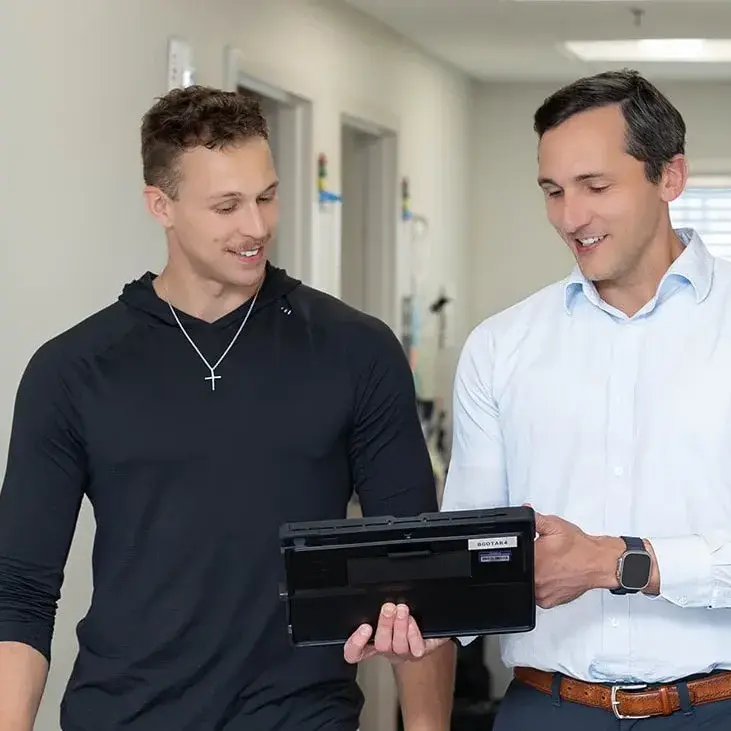 BGO Doctor consulting with patient athlete